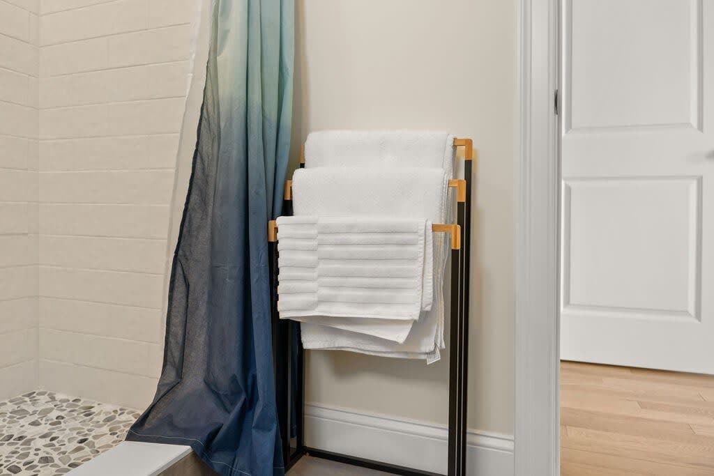 Master bedroom ensuite with heated floors and tiled shower! Clean towels provided