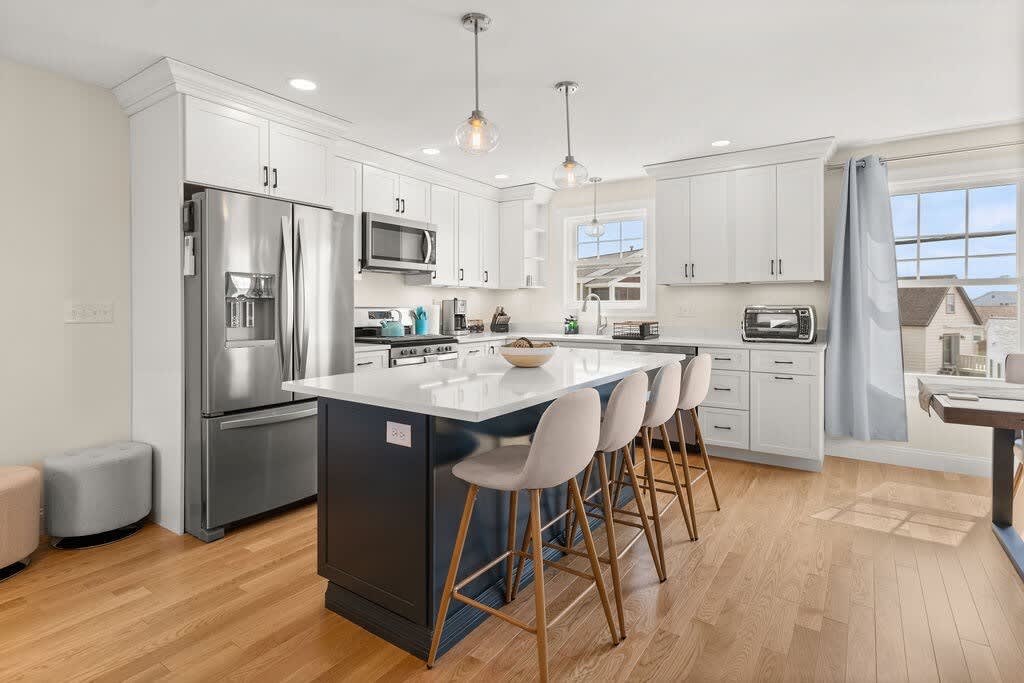 Open Kitchen, living room and dining room with high-end finishes/appliances and gas fireplace