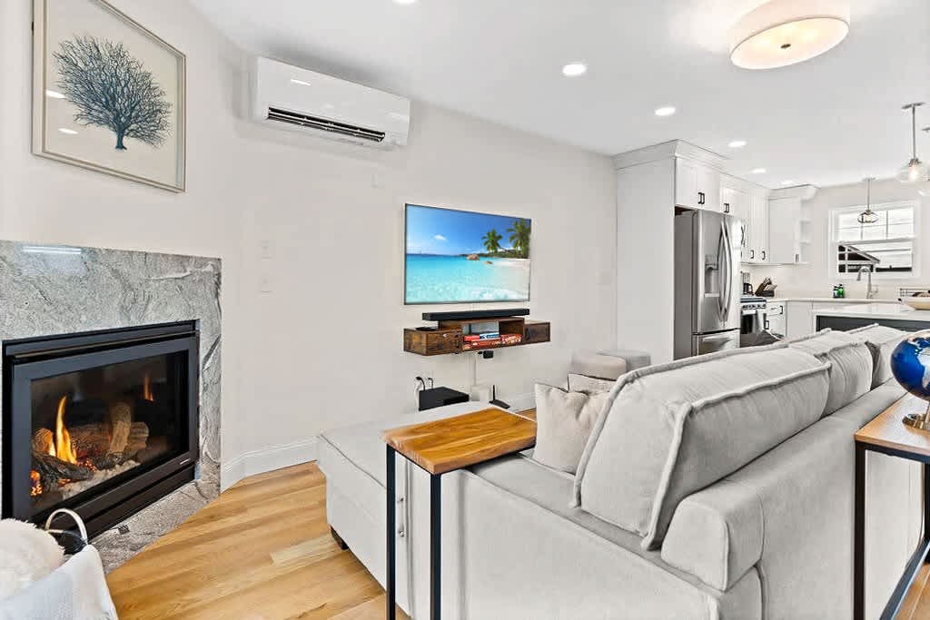 Open Kitchen, living room and dining room with high-end finishes/appliances and gas fireplace