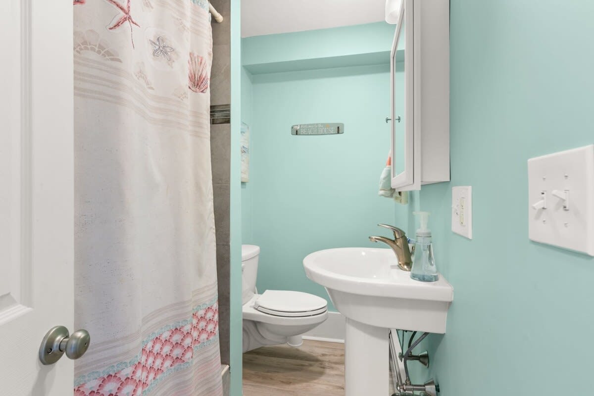 Full bathroom with tiled shower (no tub)