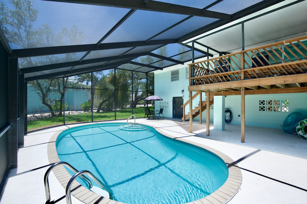 Dive into your own private screened-in pool.