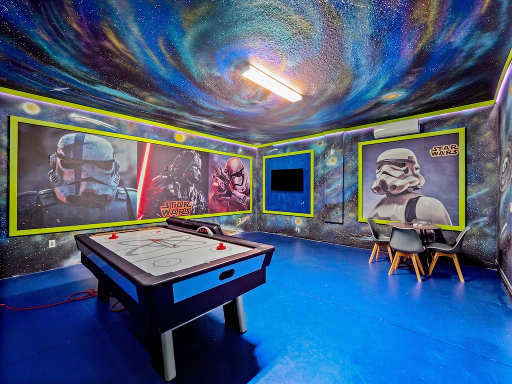 Action Packed Star Wars Themed Game Room Including Air Hockey and Lounge Area