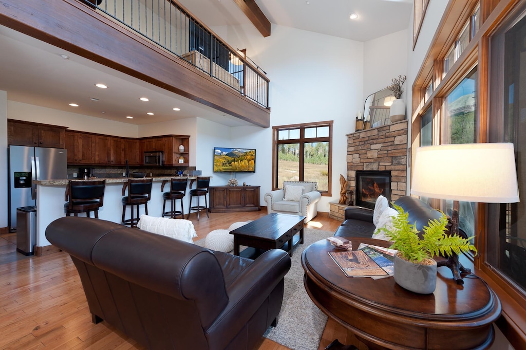 Main Living/Dining Spaces and Kitchen - TV, Gas Fireplace, Deck and views