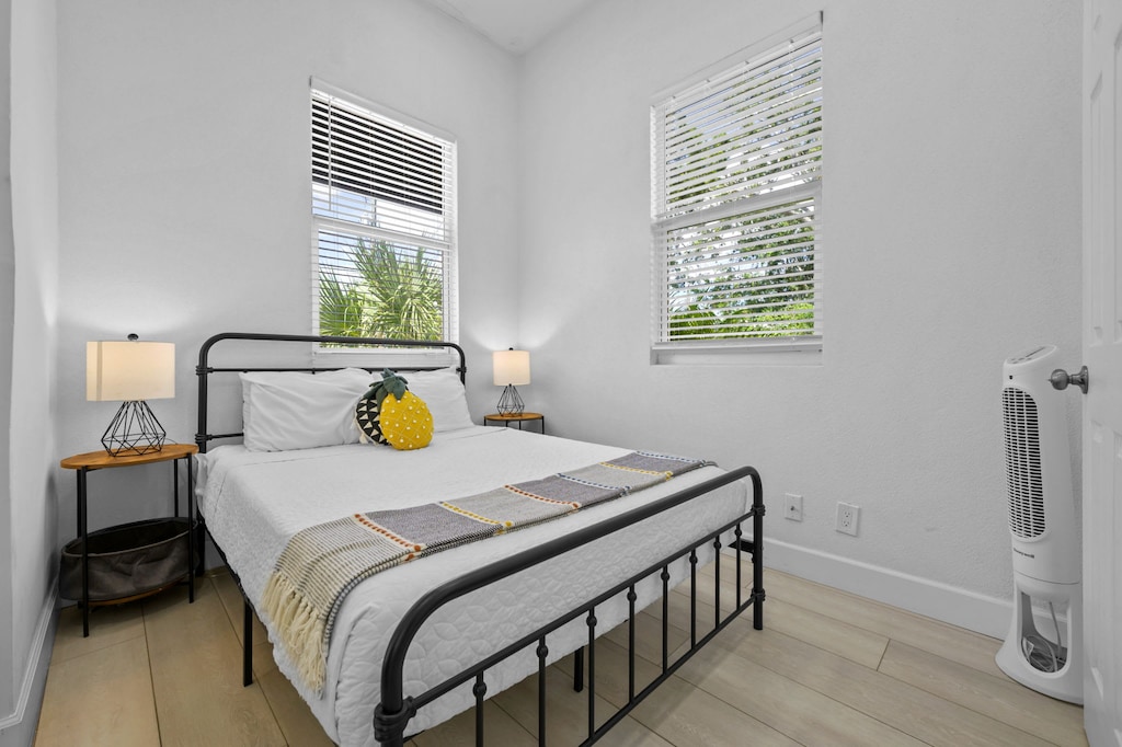 Sleep in style! Our peaceful bedroom is a sanctuary of comfort and calm. Sink into the crisp white linens and enjoy the tranquil atmosphere. That pineapple pillow? It's your official welcome to paradise.