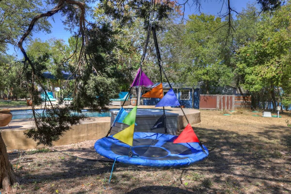 Fun hammock swing in the yard for kids.