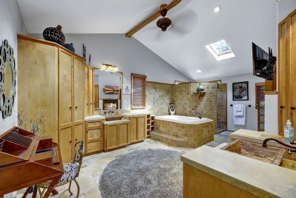 The master bath boasts modern and high-end amenities. It is beautifully designed and features a spacious walk-in shower, a large soaking tub, and elegant double sinks.