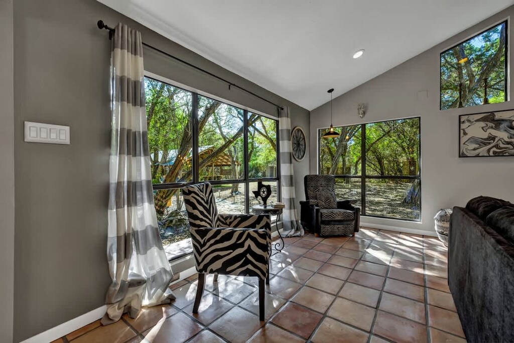 Spacious interior with ample natural light streaming in through large windows, creating an inviting atmosphere for quality family time.