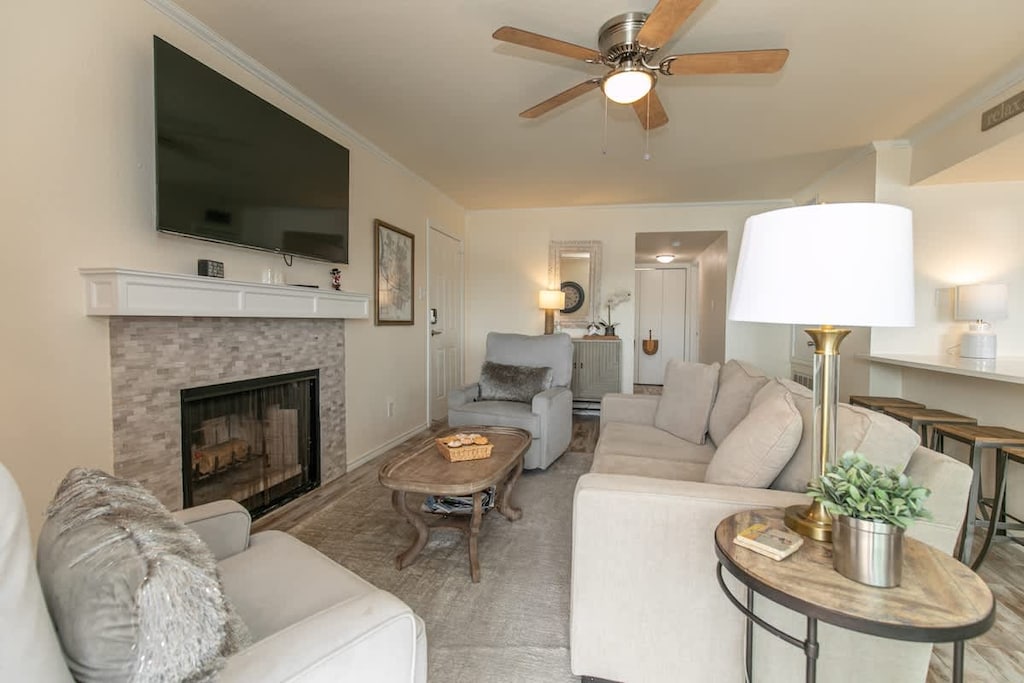 Cozy around the fireplace and flat screen TV.