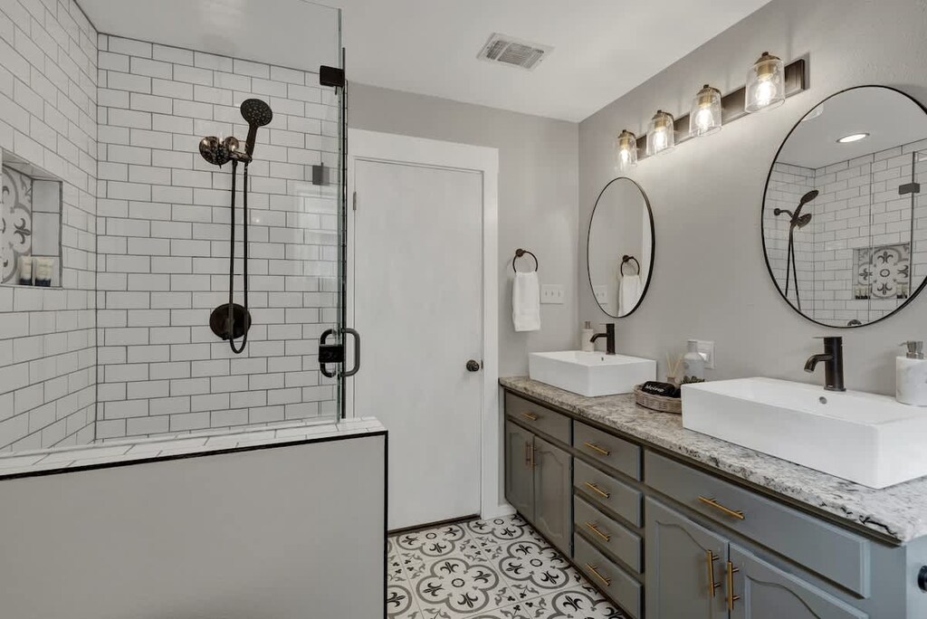 Master bathroom with standing glass shower.