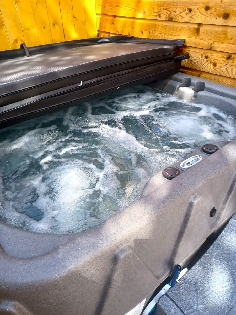 Hot Tub Located on Left Side of Cabin