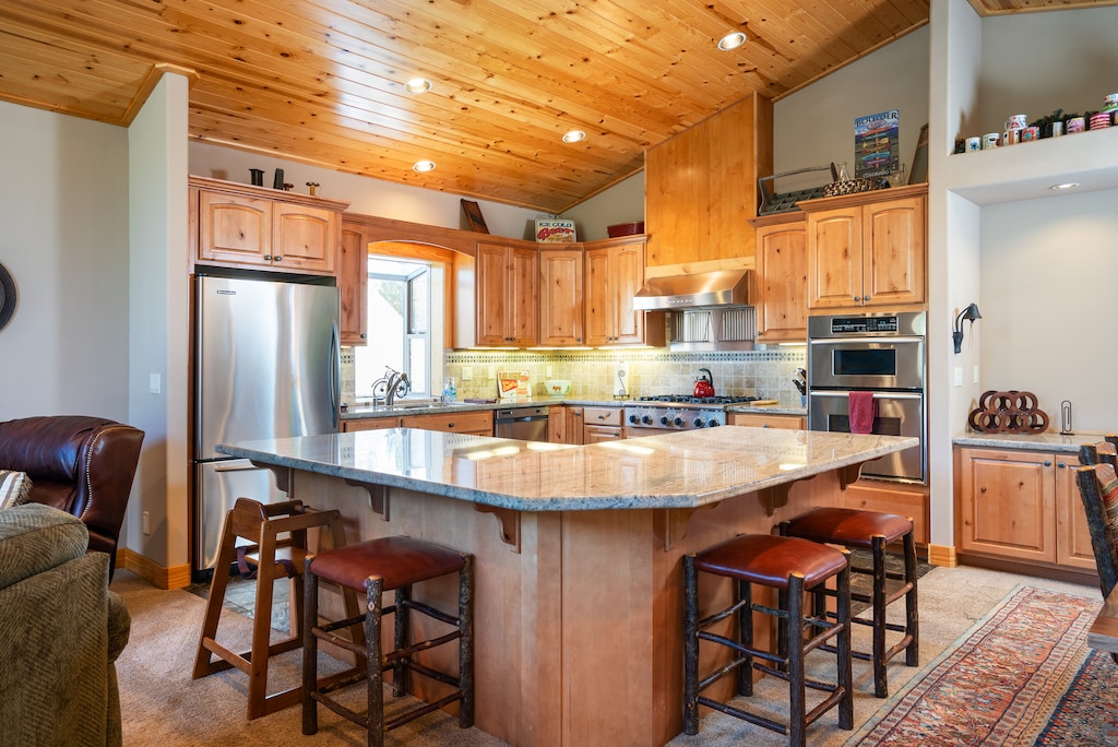 Spacious kitchen with chef-grade appliances, granite countertops, and a breakfast bar—everything you need to create your favorite meals.