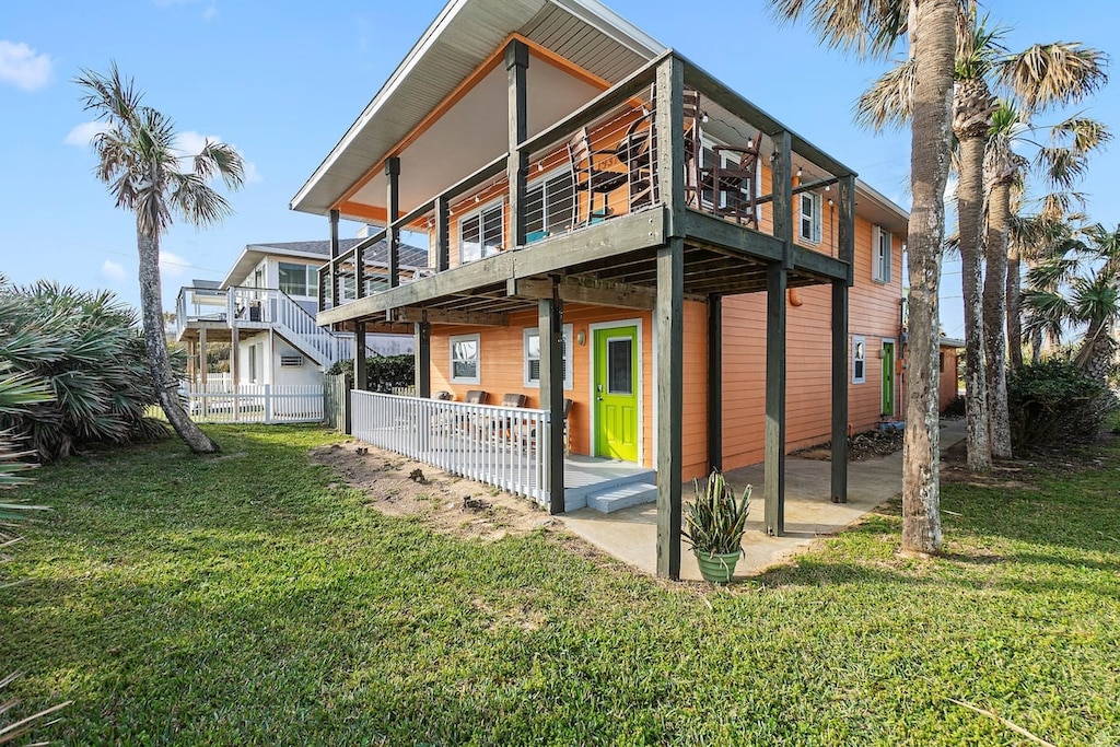 Welcome to your coastal retreat in beautiful Flagler Beach! This stunning home boasts a spacious front exterior designed for relaxation and entertaining.