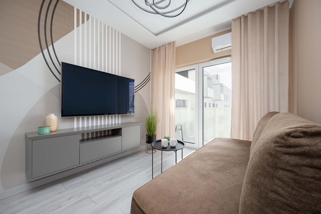 Living room with a comfortable sofa and TV. 