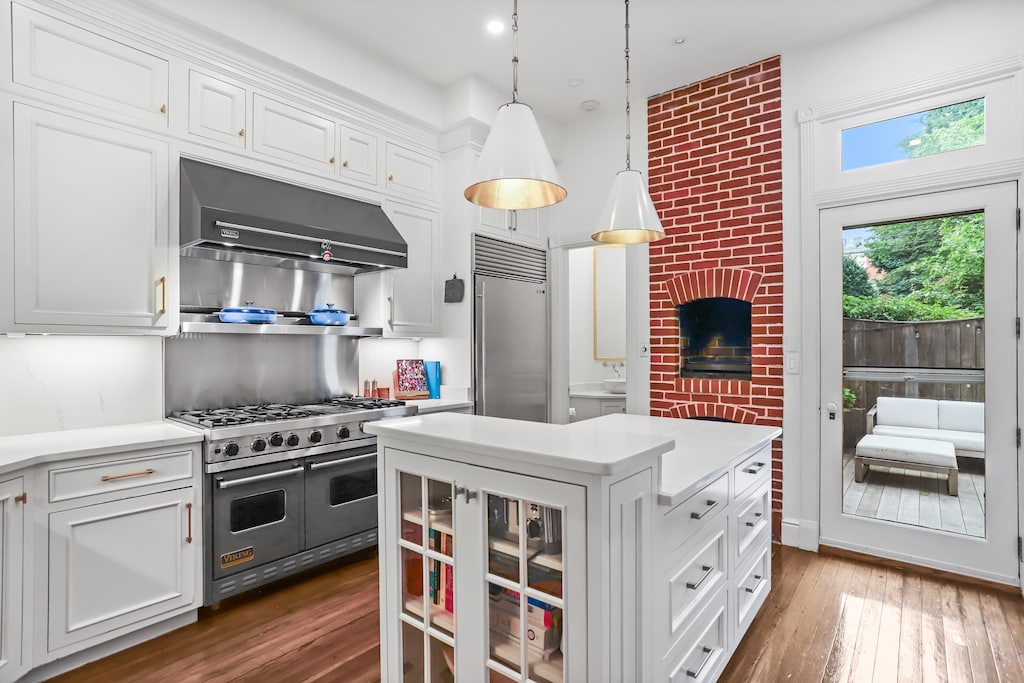 Kitchen with a door to the outside, back patio. 