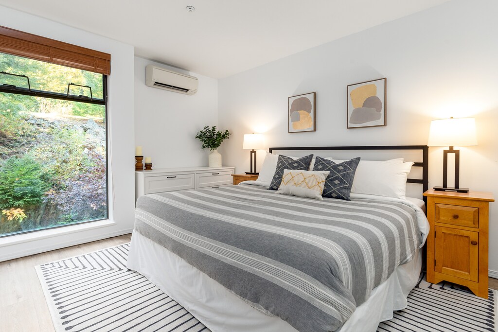 Primary Bedroom- Offering a luxurious king bed with plenty of natural light