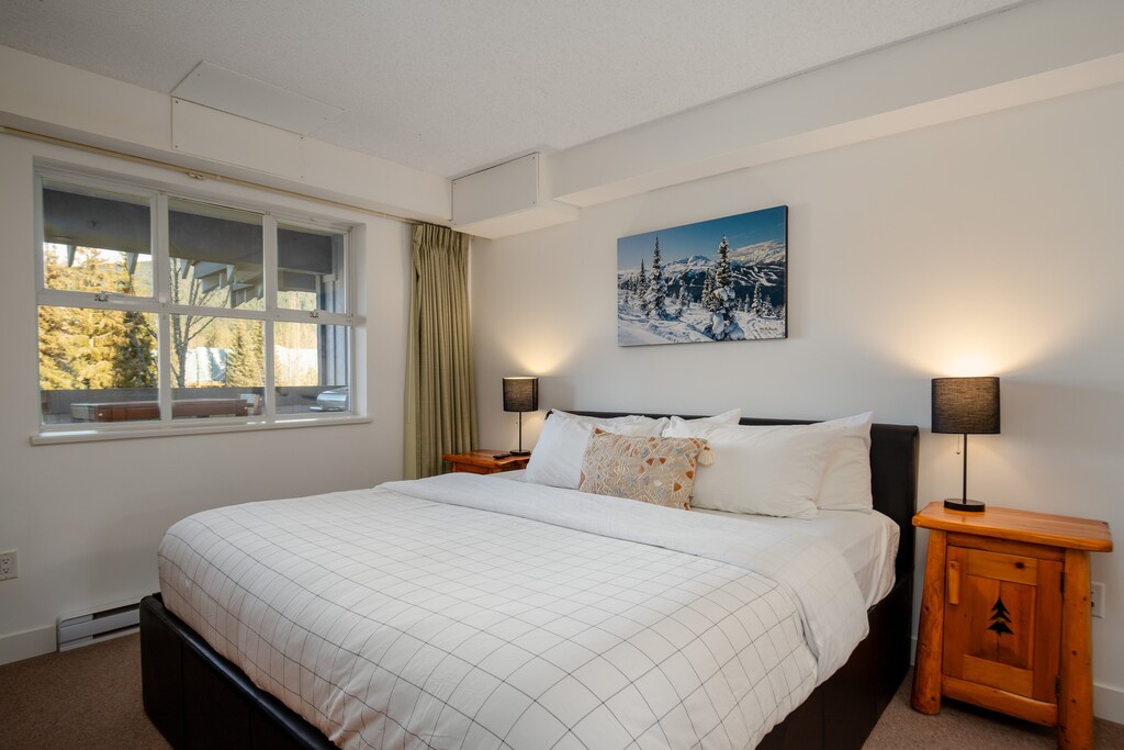 Main Bedroom - Large king bed, roku TV, dedicated workspace and ensuite bath