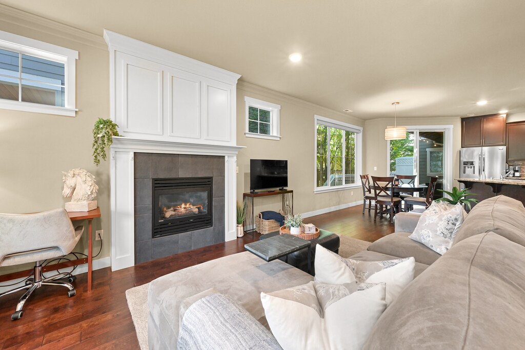 Cozy up by the gas fireplace in the inviting living room, perfect for cool Pacific Northwest evenings.