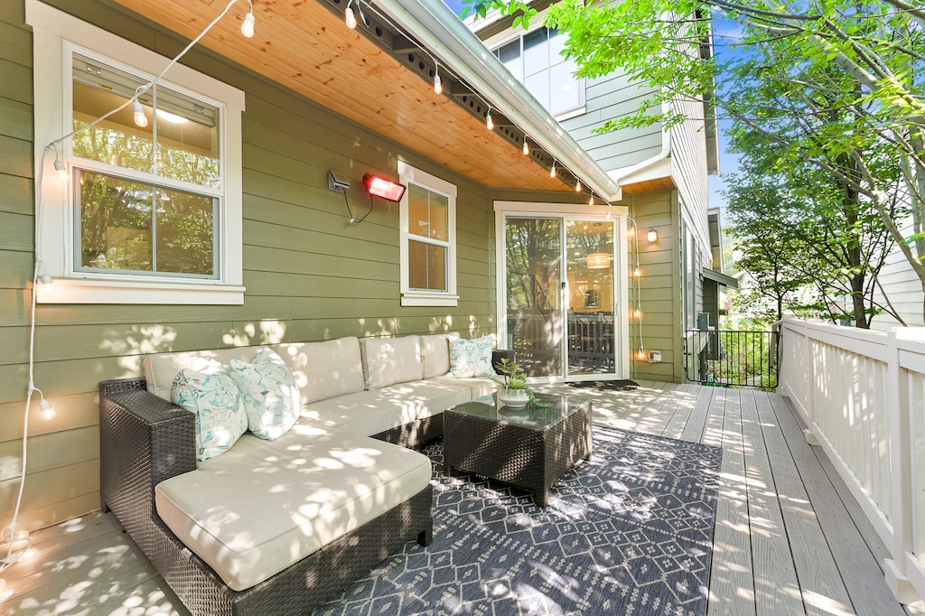 Relax outdoors on the private patio with cushioned seating and leafy shade—your personal escape in the city.