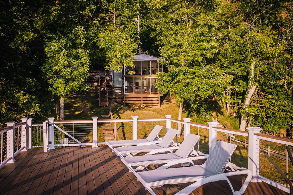 Lake front w/ 2 screened in porches & new dock!