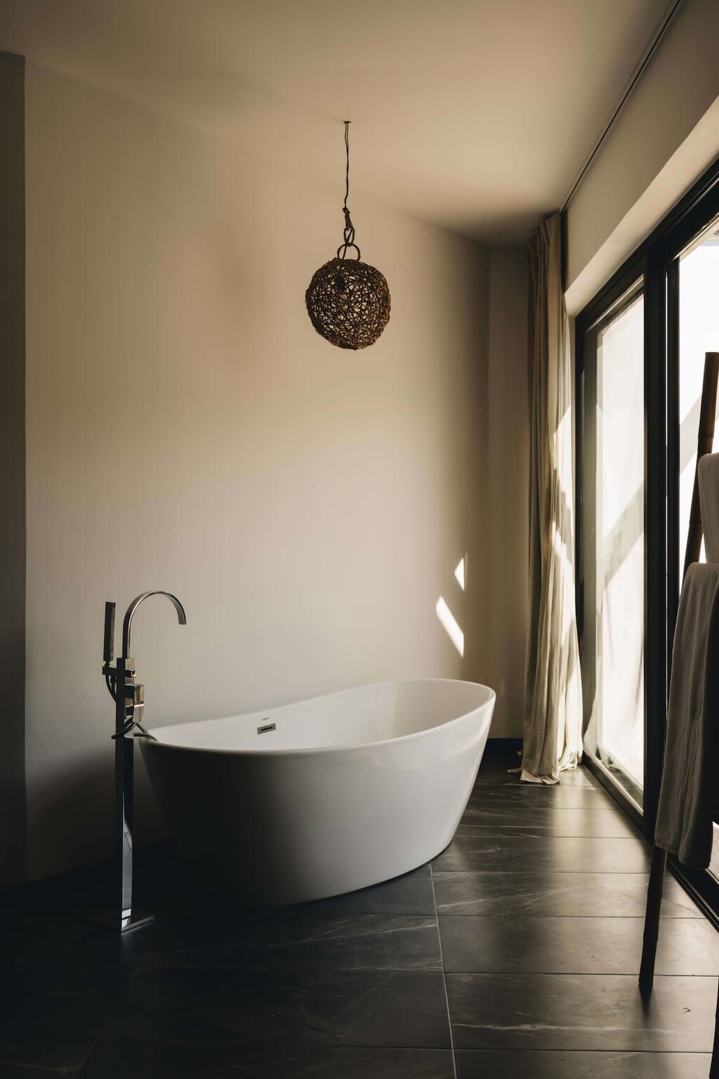 Elegant bathtub located in the master bedroom bathroom.