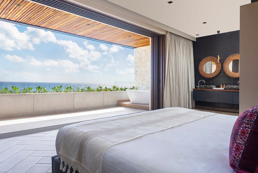 Comfortable king-size bed with a spectacular ocean view
