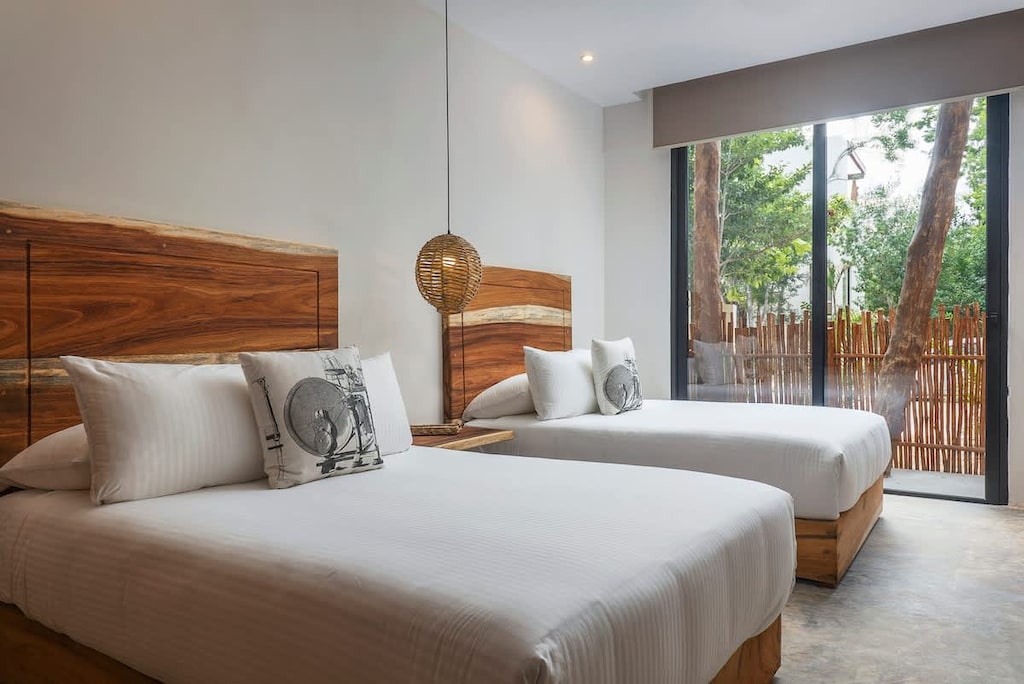 Room with comfortable double beds. Windows with an exterior view.