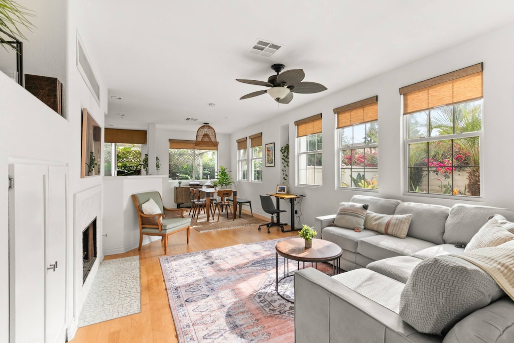 Cozy grey sectional for 6 w/wooden flooring and fireplace