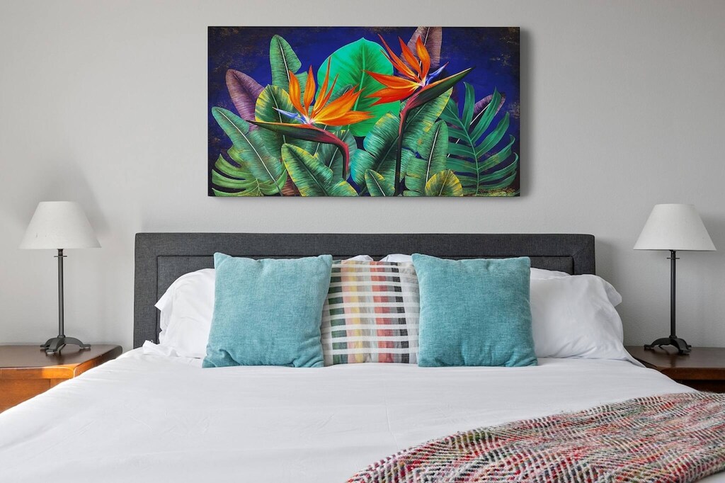 Spacious queen size bed w/ocean decor