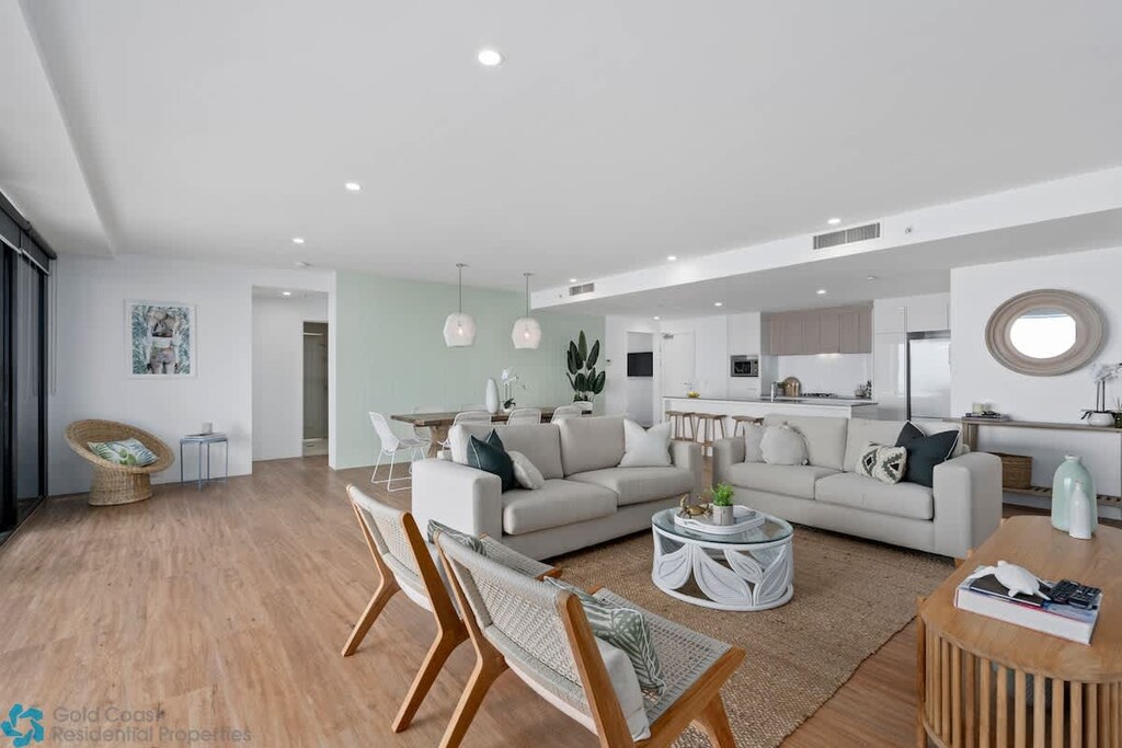 The open plan living area, with plenty of seating and stylish decor. 