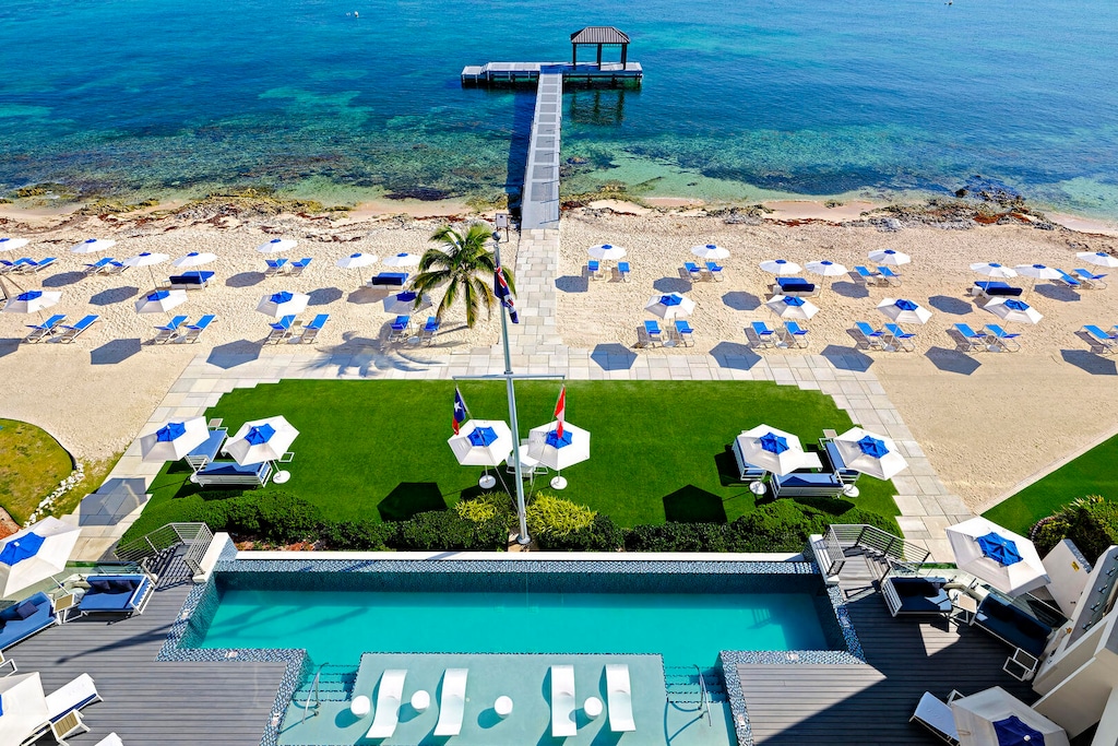 View of the resort's oceanfront pool deck. The resort's dock is equipped with a cabana and ladder for gentle water entry.