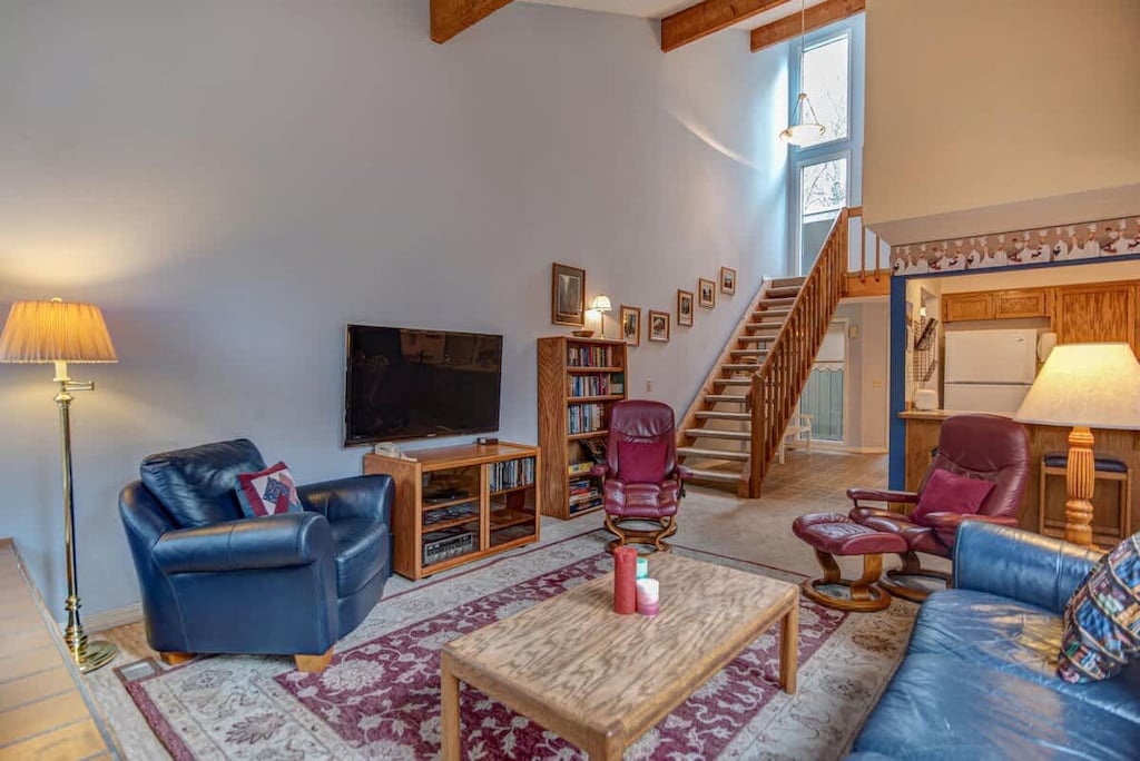 Living room and access to upstairs