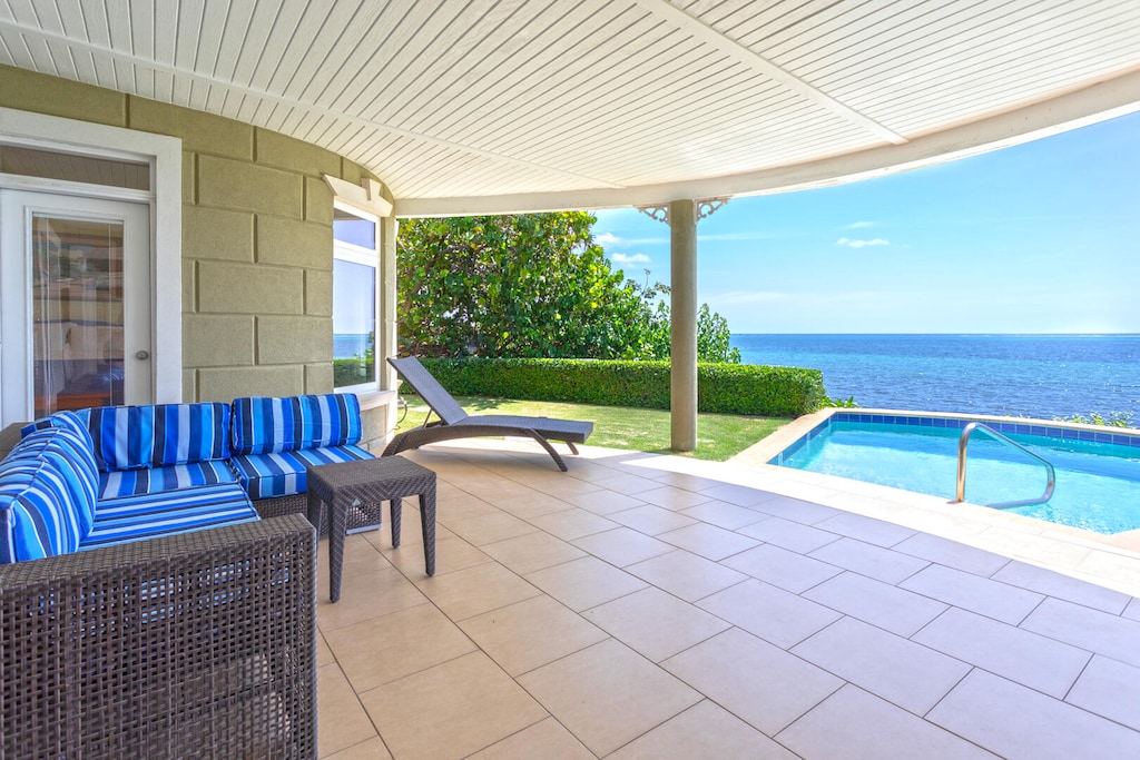 A veranda pool deck provides much need shade poolside.