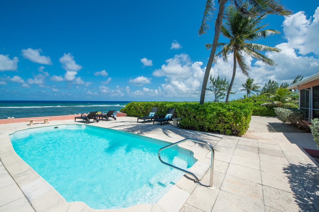 Relax and savor the panoramic views from the oceanfront pool.