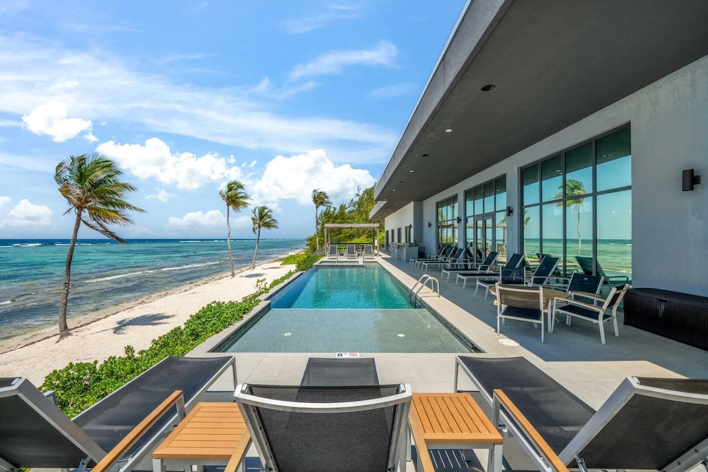 Expansive pool deck with veranda for shade.