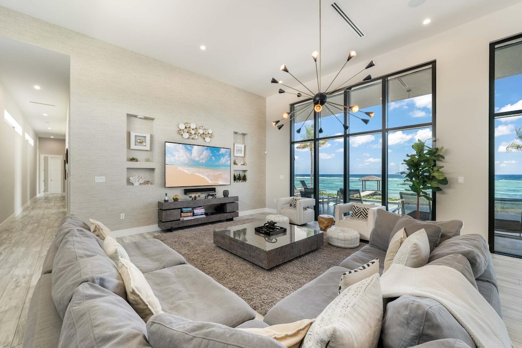 Living area with HD television, Sonos soundbar, and a plush sectional sofa.