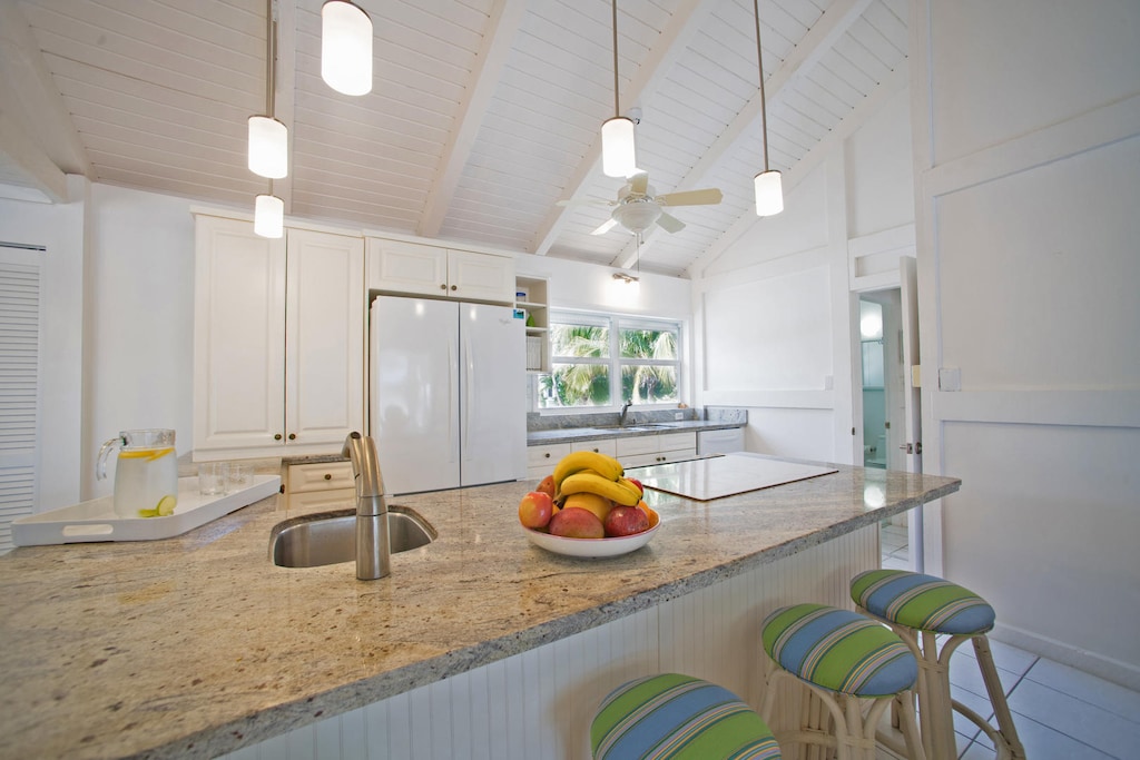 The kitchen includes island counter seating.
