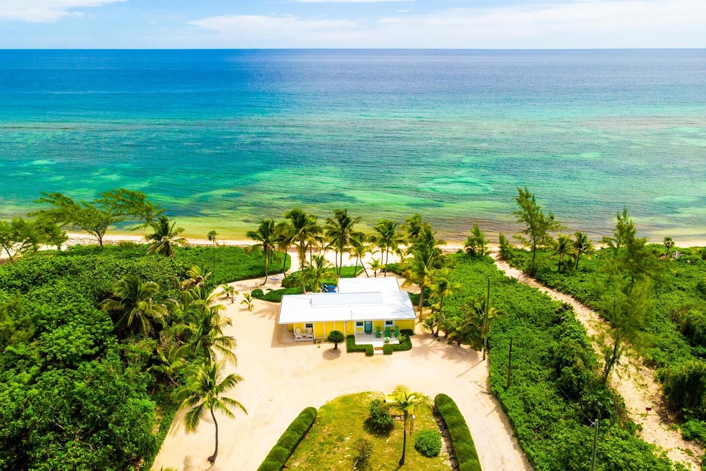 Aerial view of the home and beachfront.