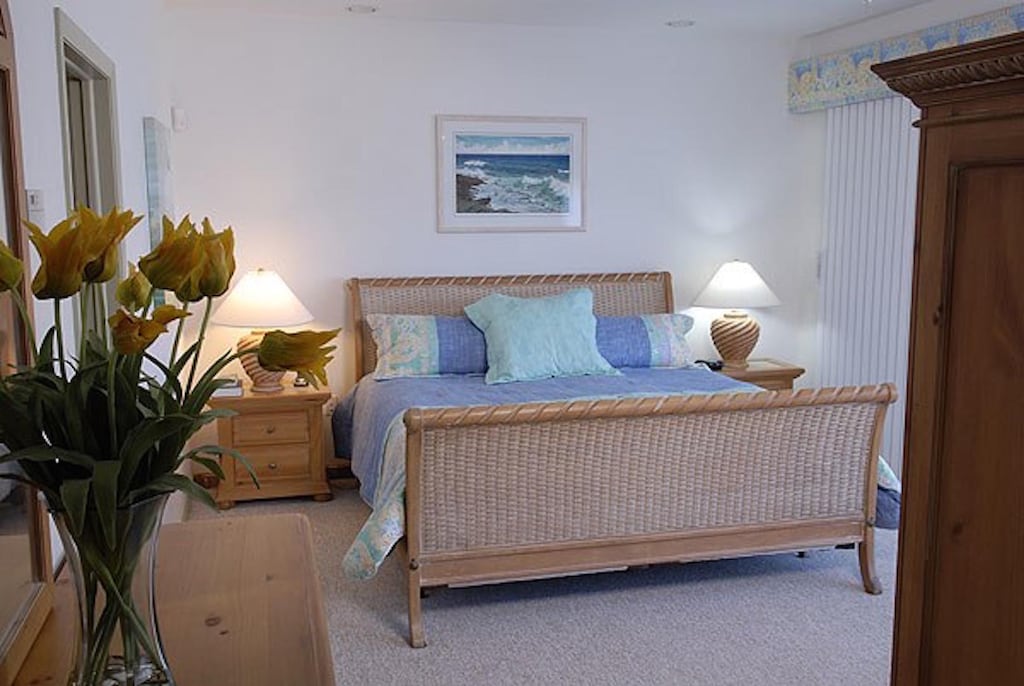 Bedroom 1 with king bed and ensuite bath on main level.