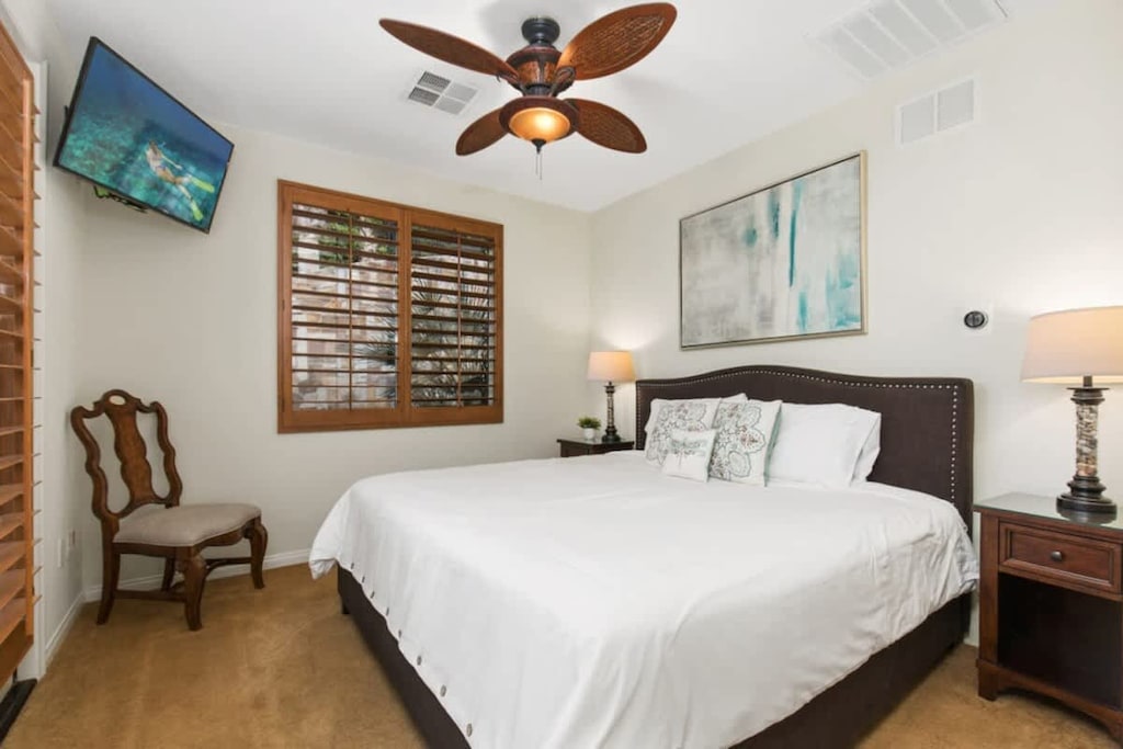 Find your bliss in this serene bedroom, where every moment is a chance to relax and recharge.