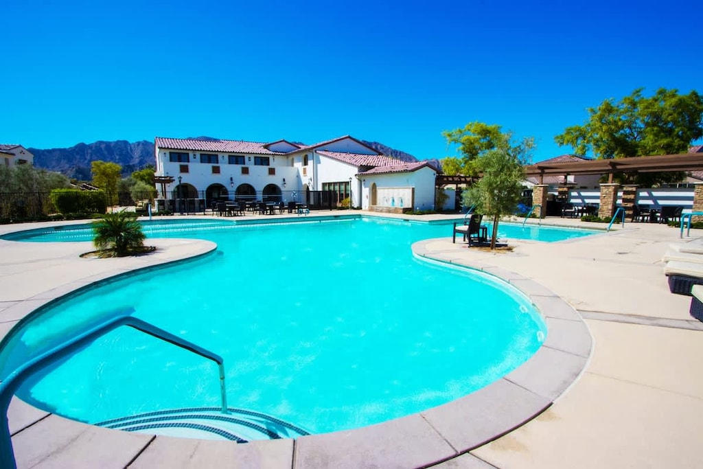 Heated pool, hot tubs, lounge chairs, and clubhouse just steps away.
