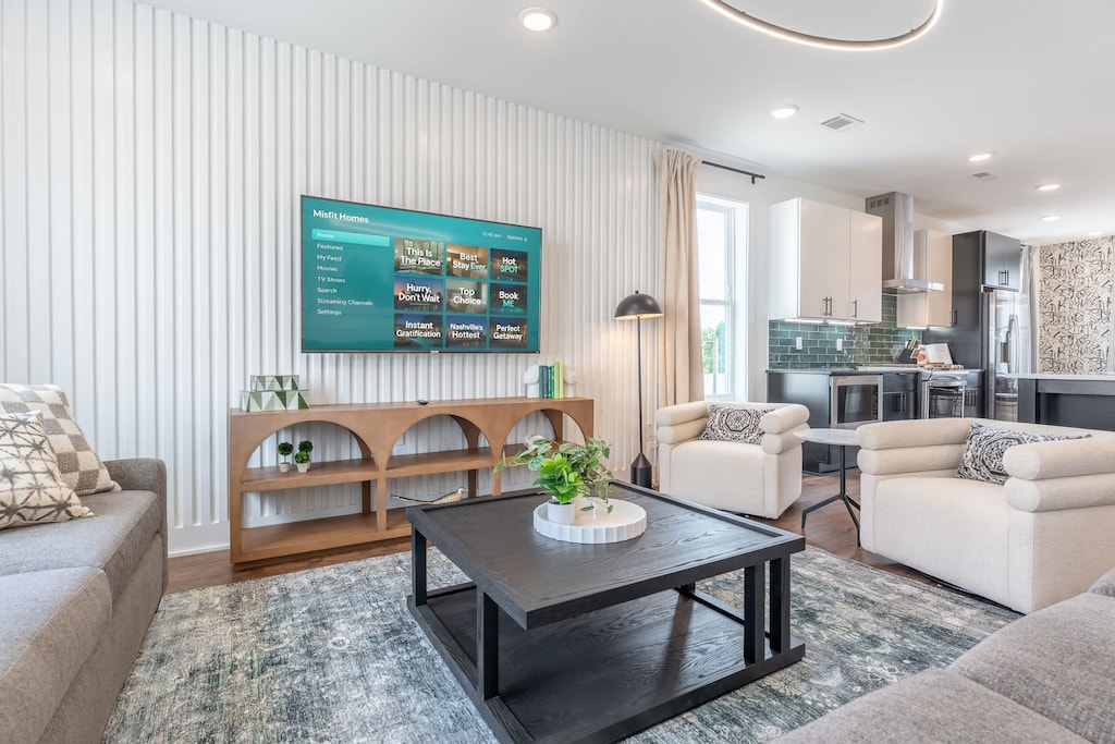 Explore your stylish Nashville oasis! This modern vacation rental features elegant decor, ample space for large groups, and a cozy living area. Enjoy the heart of Music City from this luxurious retreat!