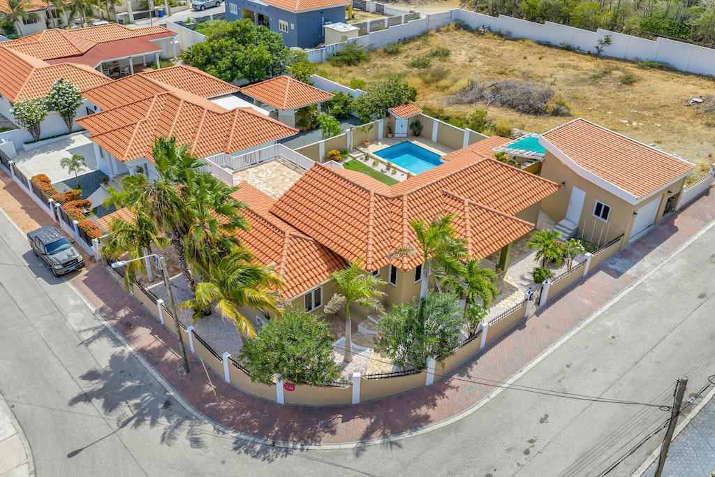 the Villa and it’s inviting pool area, harmoniously integrated into the lush natural surroundings