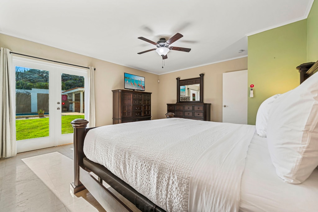 Bedroom 1 features direct access to the backyard