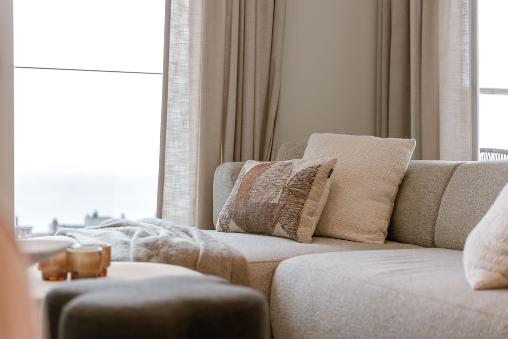 Comfortable sofa by the window, great for afternoon reading.