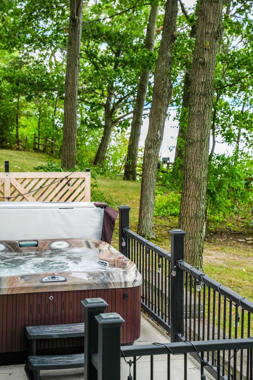 Unwind in the lakeside hot tub with unbeatable views.