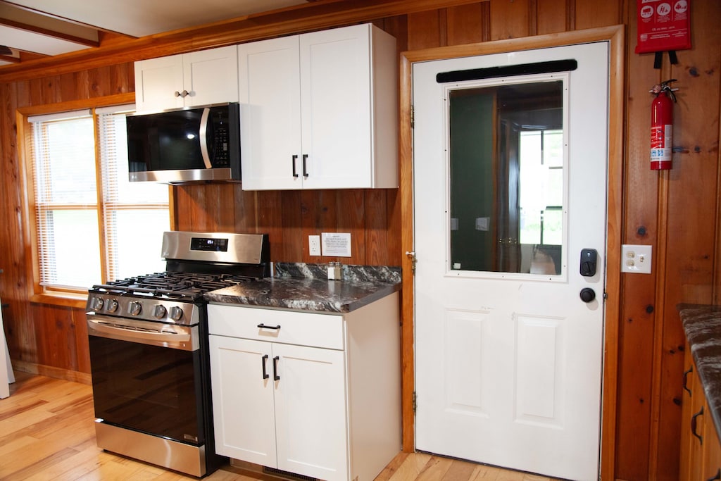 Kitchen- Enter into a fully equipped, cottage-style kitchen.