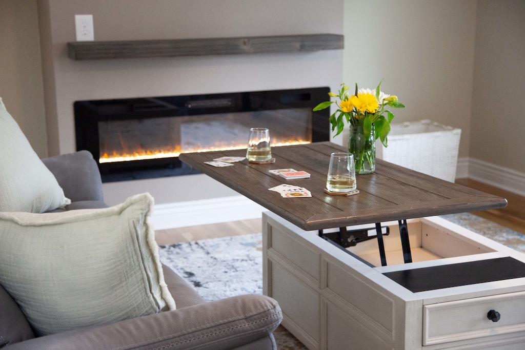 Cozy living room – Ample seating, fireplace, and smart TV.