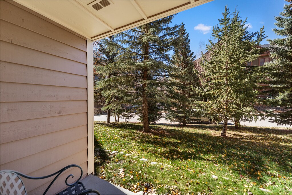 Private patio with outdoor seating and treed views