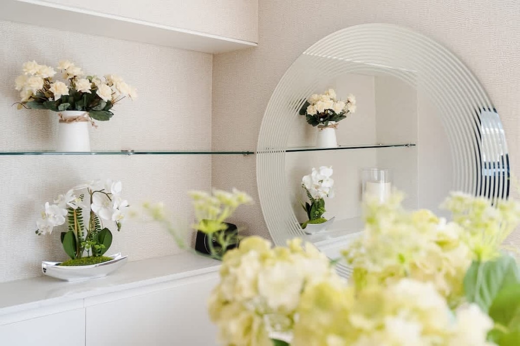 Living Room | Experience the epitome of luxury in our spacious living room, seamlessly integrated with an open-plan kitchen. Enjoy the grandeur of a 55-inch TV while staying comfortably cool with the air conditioning.