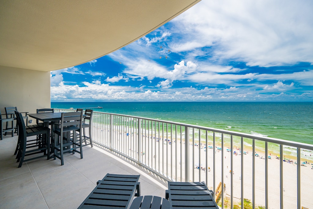 Take in the stunning beachfront views of the vibrant water and coastline from your balcony